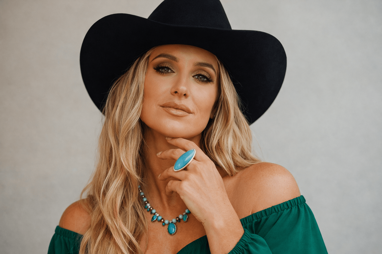 Lainey Wilson performing in her signature style